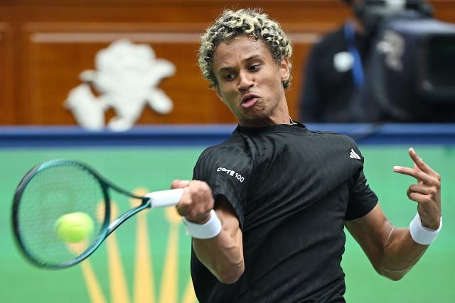 Canada’s Gabriel Diallo hits a return to Belgium’s Zizou Bergs during their men's singles match at the Shanghai Masters tennis tournament in Shanghai on October 7, 2025. (Photo by Jade Gao / AFP)
