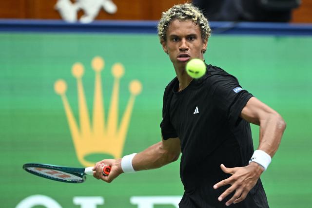 Canada’s Gabriel Diallo hits a return to Belgium’s Zizou Bergs during their men's singles match at the Shanghai Masters tennis tournament in Shanghai on October 7, 2025. (Photo by Jade Gao / AFP)