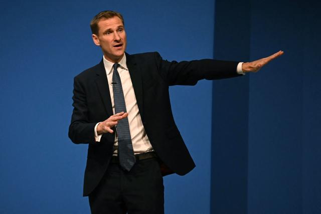 Britain's main opposition Conservative Party Shadow Home Secretary Chris Philp gestures as he delivers a speech on the third day of the annual Conservative Party conference in Manchester, north-west England, on October 7, 2025.  (Photo by Paul ELLIS / AFP)