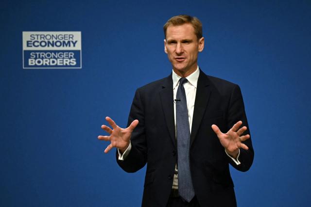 Britain's main opposition Conservative Party Shadow Home Secretary Chris Philp gestures as he delivers a speech on the third day of the annual Conservative Party conference in Manchester, north-west England, on October 7, 2025.  (Photo by Paul ELLIS / AFP)