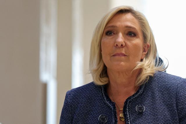 (FILES) President of the parliamentary group of the French far-right Rassemblement National (RN) party, Marine Le Pen arrives at the Paris courthouse for her trial verdict on suspicion of embezzlement of European public funds, in Paris, on March 31, 2025. The Council of State will examine, on October 10, 2025, Marine Le Pen's appeal against her automatic resignation from the departmental council of Pas-de-Calais after being sentenced to five years of ineligibility for embezzlement of public funds by the Paris Criminal Court on March 31, 2025. (Photo by Alain JOCARD / AFP)