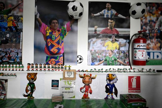 Posters of football players are pictured inside of the Mexican restaurant "Tortas Estadio," located in front of the Azteca Stadium in the Santa Ursula neighborhood in Mexico City on October 9, 2025. (Photo by Alfredo ESTRELLA / AFP)