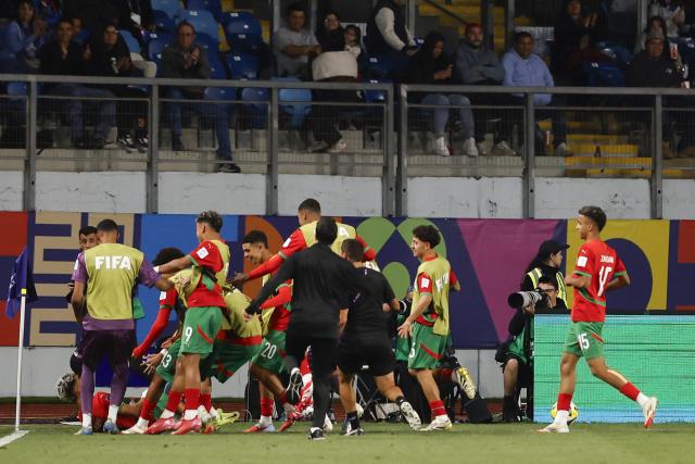 Morocco's players celebrate scoring the second goal by foward #21 Yassir Zabiri during the 2025 FIFA U-20 World Cup round of 16 football match between Morocco and South Korea at El Teniente Stadium in Rancagua, Chile on October 9, 2025. (Photo by Raul BRAVO / AFP)