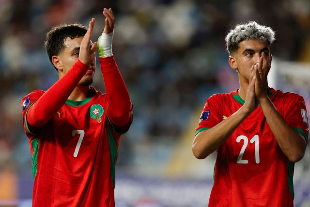 Morocco's foward #7 Othmane Maamma and foward #21 Yassir Zabiri react during the 2025 FIFA U-20 World Cup round of 16 football match between Morocco and South Korea at El Teniente Stadium in Rancagua, Chile on October 9, 2025. (Photo by Raul BRAVO / AFP)