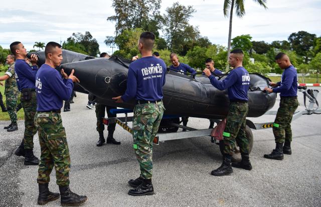 Thai Marines take part in an exercise in anticipation of floods during the rainy season in the Chulabhorn military camp in Thailand's southern province of Narathiwat on October 10, 2025. (Photo by Madaree TOHLALA / AFP)