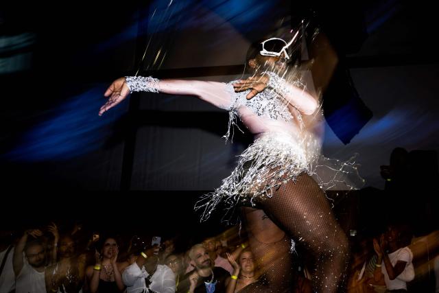 (FILES) "Legend" Vinii Revlon vogues during the "Stars of Paris are Shining Ball", a voguing event at la Gaite Lyrique, in Paris, on June 17, 2023. She moves LGBT+ communities around the world and has inspired Madonna, Beyoncé, and Lady Gaga: ballroom, a queer culture from which voguing originates and long present in Paris, is spreading in France with a recently launched scene in Lille. (Photo by Julie SEBADELHA / AFP)