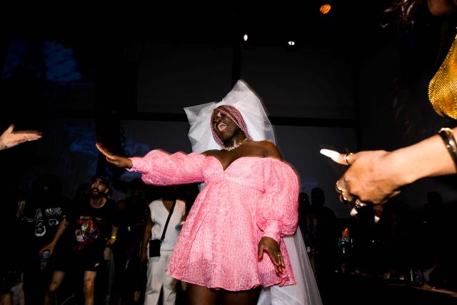 (FILES) A dancer vogues during the "Stars of Paris are Shining Ball", a voguing event at la Gaite Lyrique, in Paris, on June 17, 2023. She moves LGBT+ communities around the world and has inspired Madonna, Beyoncé, and Lady Gaga: ballroom, a queer culture from which voguing originates and long present in Paris, is spreading in France with a recently launched scene in Lille. (Photo by Julie SEBADELHA / AFP)