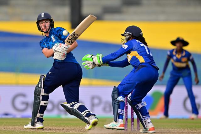 England's captain Nat Sciver-Brunt (L) plays a shot during the ICC Women's Cricket World Cup 2025 one-day international (ODI) match between Sri Lanka and England at the R. Premadasa International Cricket Stadium in Colombo on October 11, 2025. (Photo by Ishara S. KODIKARA / AFP)