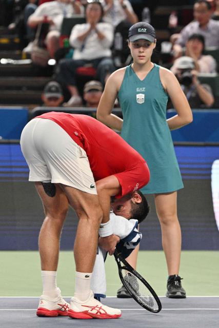 Serbia's Novak Djokovic reacts during his men's singles semi-final match against Monaco's Valentin Vacherot at the Shanghai Masters tennis tournament in Shanghai on October 11, 2025. (Photo by Hector RETAMAL / AFP)