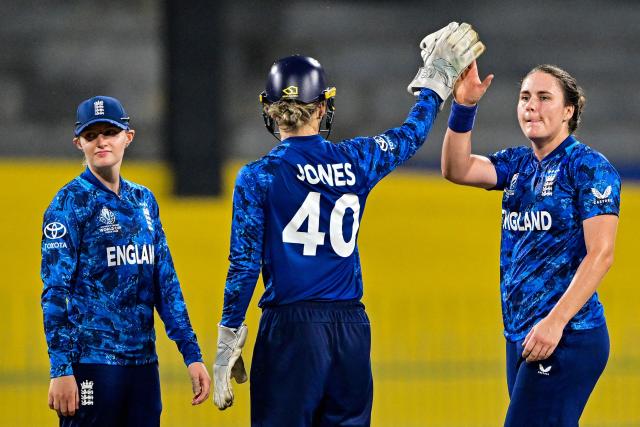 England's captain Nat Sciver-Brunt (R) celebrates with teammates after taking the wicket of Sri Lanka's Dewmi Vihanga during the ICC Women's Cricket World Cup 2025 one-day international (ODI) match between Sri Lanka and England at the R. Premadasa International Cricket Stadium in Colombo on October 11, 2025. (Photo by Ishara S. KODIKARA / AFP)