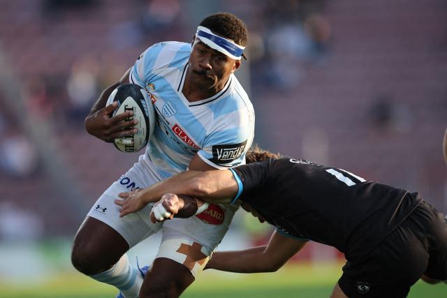 Racing 92' Fijian winger Vinaya Habosi (L) is tackled by Montpellier’s Melvyn Rates during the French Top14 rugby union match between Racing92 and Montpellier at the Dominique Duvauchelle stadium in Creteil, on October 11, 2025. (Photo by Anne-Christine POUJOULAT / AFP)
