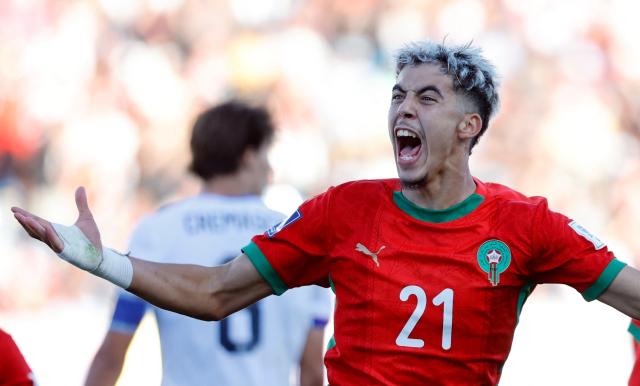 Morocco's foward #21 Yassir Zabiri celebrates after an own goal scored by United States' defender #04 Joshua Wynder (out of frame) during the 2025 FIFA U-20 World Cup quarter-final football match between United States and Morocco at the El Teniente Stadium in Rancagua, Chile on October 12, 2025. (Photo by Raul BRAVO / AFP)