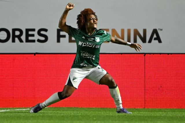 Deportivo Cali's forward #09 Maria Marquinez celebrates scoring her team's first goal during the 2025 Women's Copa Libertadores quarter-final football match between Colombia's Deportivo Cali and Brazil's Sao Paulo at the Florencio Sola Stadium in Banfield, Buenos Aires province on October 12, 2025. (Photo by Luis ROBAYO / AFP)
