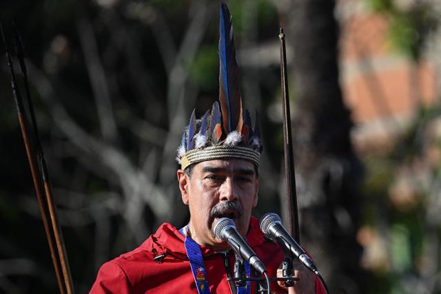 Venezuela's President Nicolas Maduro speaks during a march to commemorate the "Day of Indigenous Resistance" in Caracas on October 12, 2025. On Sunday, Venezuelan President Nicolбs Maduro called opposition leader Marнa Corina Machado a “demonic witch,” two days after she was awarded the Nobel Peace Prize. (Photo by Federico PARRA / AFP)