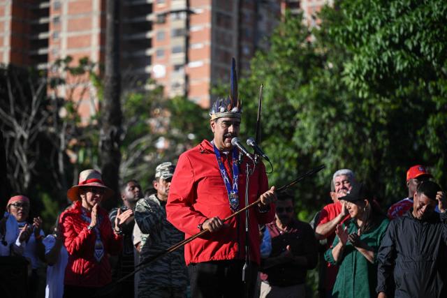 Venezuela's President Nicolas Maduro speaks during a march to commemorate the "Day of Indigenous Resistance" in Caracas on October 12, 2025. On Sunday, Venezuelan President Nicolбs Maduro called opposition leader Marнa Corina Machado a “demonic witch,” two days after she was awarded the Nobel Peace Prize. (Photo by Federico PARRA / AFP)