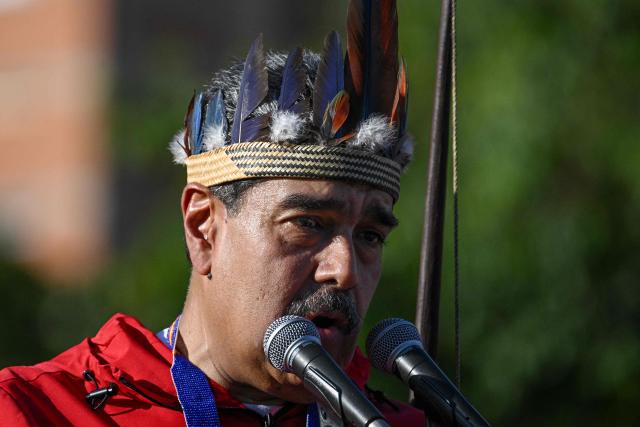 Venezuela's President Nicolas Maduro speaks during a march to commemorate the "Day of Indigenous Resistance" in Caracas on October 12, 2025. On Sunday, Venezuelan President Nicolбs Maduro called opposition leader Marнa Corina Machado a “demonic witch,” two days after she was awarded the Nobel Peace Prize. (Photo by Federico PARRA / AFP)