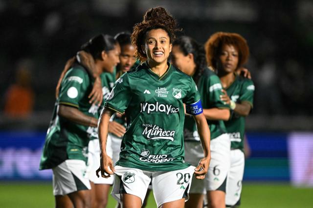 Deportivo Cali's midfielder #20 Paola Garcia celebrates after scoring her penalty kick and her team's second goal during the 2025 Women's Copa Libertadores quarter-final football match between Colombia's Deportivo Cali and Brazil's Sao Paulo at the Florencio Sola Stadium in Banfield, Buenos Aires province on October 12, 2025. (Photo by Luis ROBAYO / AFP)