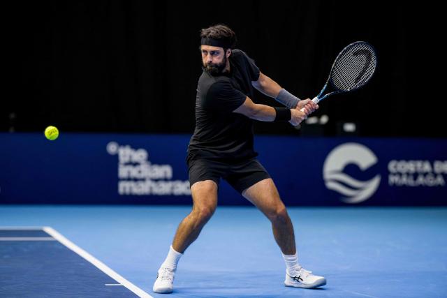 Georgia's Nikoloz Basilashvili plays a backhand return to France's Pierre-Hugues Herbert during the European Open ATP tennis tournament in Brussels, on October 13, 2025. (Photo by JASPER JACOBS / Belga / AFP) / Belgium OUT