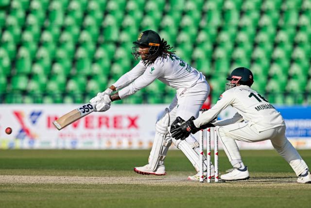 South Africa's Tony de Zorzi (L) plays a shot during the second day of the first Test cricket match between Pakistan and South Africa at the Gaddafi Stadium in Lahore on October 13, 2025. (Photo by Aamir QURESHI / AFP)