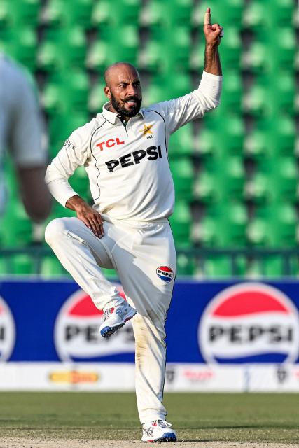 Pakistan's Sajid Khan celebrates after taking the wicket of South Africa's Dewald Brevis during the second day of the first Test cricket match between Pakistan and South Africa at the Gaddafi Stadium in Lahore on October 13, 2025. (Photo by Aamir QURESHI / AFP)