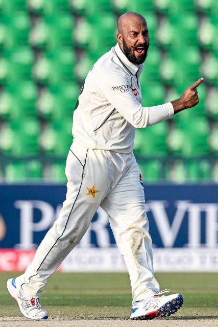 Pakistan's Sajid Khan celebrates after taking the wicket of South Africa's Dewald Brevis during the second day of the first Test cricket match between Pakistan and South Africa at the Gaddafi Stadium in Lahore on October 13, 2025. (Photo by Aamir QURESHI / AFP)
