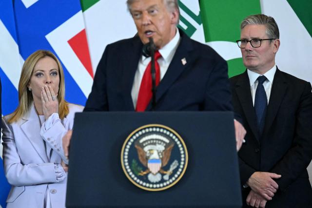 US President Donald Trump (C) speaks as Italian Prime Minister Giorgia Meloni (L) and Britain's Prime Minister Keir Starmer watch during the Sharm El-Sheikh Peace Summit in the Egyptian Red Sea resort town of Sharm el-Sheikh on October 13, 2025. Trump on October 13 hailed a Gaza summit in Egypt as a "tremendous day" for the Middle East, saying a document would be signed on "rules and regulations" for future talks. (Photo by SAUL LOEB / AFP)