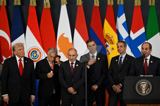 US President Donald Trump listens as Egypt's President Abdel Fattah al-Sisi (R) delivers a statement during a summit on Gaza in Sharm el-Sheikh on October 13, 2025. Trump landed in Egypt on October 13 for a summit on Gaza, following a lightning visit to Israel after a ceasefire he brokered entered into force. (Photo by Khaled DESOUKI / AFP)