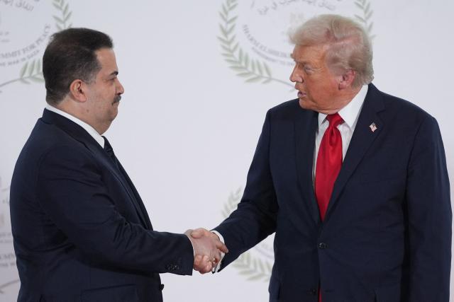 US President Donald Trump greets Iraq's Prime Minister Mohammed Shia al-Sudani during a summit on Gaza in Sharm el-Sheikh on October 13, 2025. Trump landed in Egypt on October 13 for a summit on Gaza, following a lightning visit to Israel after a ceasefire he brokered entered into force. (Photo by Evan Vucci / POOL / AFP)