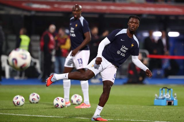 France's midfielder #06 Eduardo Camavinga plays the ball during warm up prior to the 2026 World Cup qualifying round Group D football match between Iceland and France at the Laugardalsvollur Stadium in Reykjavik on October 13, 2025. (Photo by FRANCK FIFE / AFP)