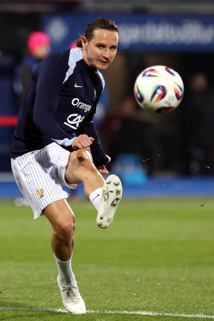 France's forward #20 Florian Thauvin kicks the ball as he warms up prior to the 2026 World Cup qualifying round Group D football match between Iceland and France at the Laugardalsvollur Stadium in Reykjavik on October 13, 2025. (Photo by FRANCK FIFE / AFP)