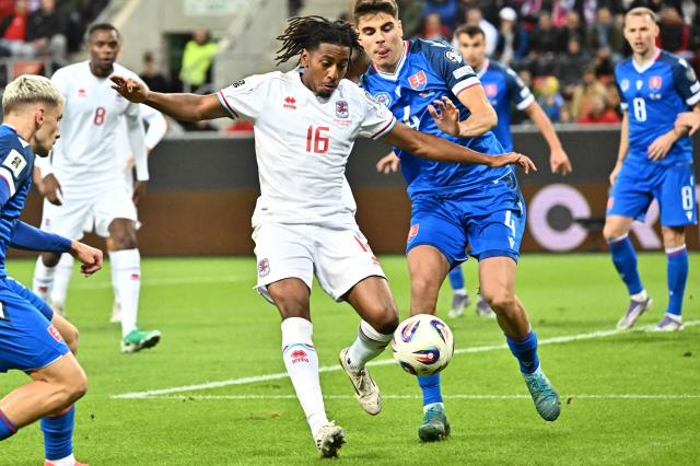 Luxembourg's midfielder #16 Leandro Barreiro (L) and Slovakia's defender #04 Adam Obert vie for the ball during the 2026 World Cup qualifying group A football match between Slovakia and Luxembourg in Trnava, Slovakia on October 13, 2025, (Photo by Joe Klamar / AFP)