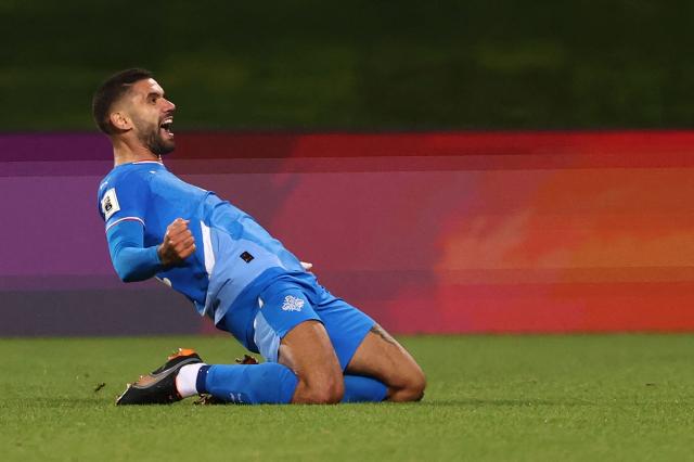 Iceland's defender #04 Victor Palsson celebrates scoring his team's first goal during the 2026 World Cup qualifying round Group D football match between Iceland and France at the Laugardalsvollur Stadium in Reykjavik on October 13, 2025. (Photo by FRANCK FIFE / AFP)