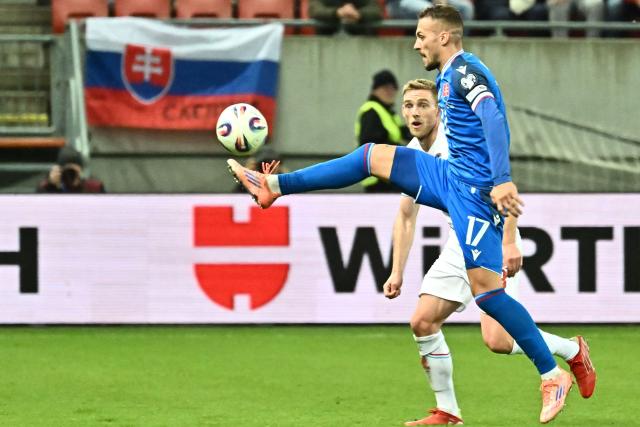 Slovakia's midfielder #17 Lukas Haraslin (R) controls the ball during the 2026 World Cup qualifying group A football match between Slovakia and Luxembourg in Trnava, Slovakia on October 13, 2025, (Photo by Joe Klamar / AFP)