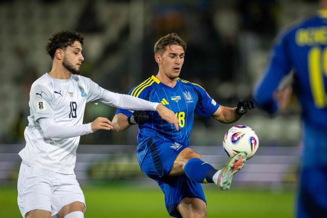 Azerbaijan's forward #19 Nariman Akhundzade (L) and Ukraine's midfielder #18 Yehor Yarmoliuk (R) vie for the ball during the 2026 World Cup qualifying group B, football match between Ukraine and Azerbaijan in Krakow, Poland, on October 13, 2025, (Photo by Wojtek RADWANSKI / AFP)