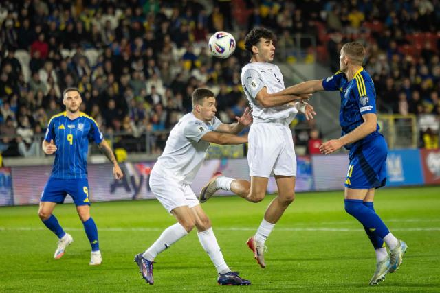 Ukraine's midfielder #09 Oleksii Hutsuliak (L), Azerbaijan's defender #05 Anton Krivotyuk (2nd L), Azerbaijan's defender #04 Bahlul Mustafazade (2nd R) and Ukraine's forward #11 Artem Dovbyk (R) vie for the ball during the 2026 World Cup qualifying group B, football match between Ukraine and Azerbaijan in Krakow, Poland, on October 13, 2025, (Photo by Wojtek RADWANSKI / AFP)