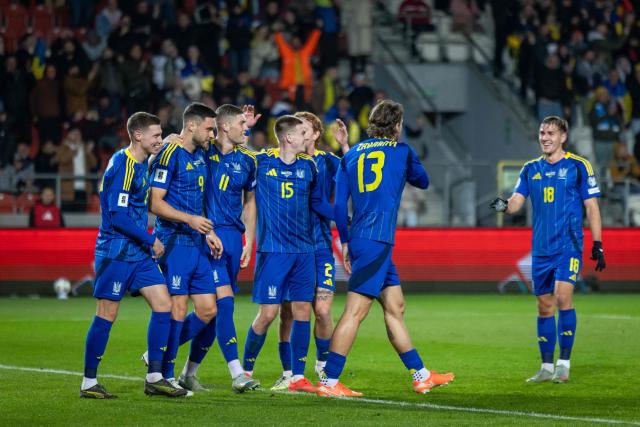 Ukrainian players celebrate scoring the opening goal  during the 2026 World Cup qualifying group B, football match between Ukraine and Azerbaijan in Krakow, Poland, on October 13, 2025, (Photo by Wojtek RADWANSKI / AFP)
