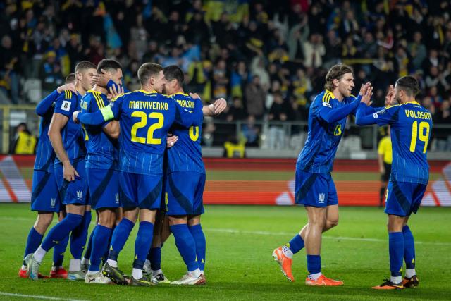 Ukrainian players celebrate scoring the opening goal  during the 2026 World Cup qualifying group B, football match between Ukraine and Azerbaijan in Krakow, Poland, on October 13, 2025, (Photo by Wojtek RADWANSKI / AFP)