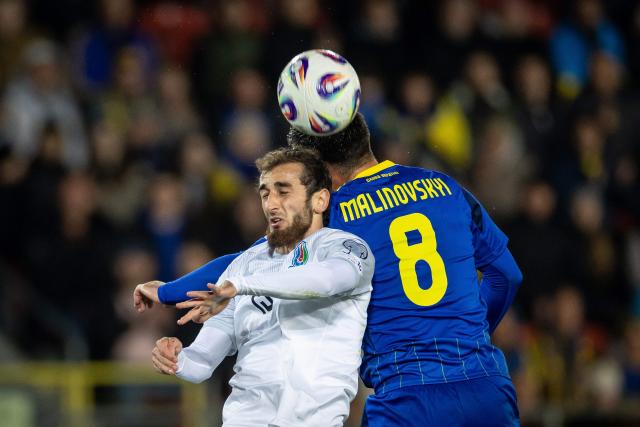 Azerbaijan's midfielder #17 Toral Bayramov (L) and Ukraine's midfielder #08 Ruslan Malinovskyi vie for the ball during the 2026 World Cup qualifying group B, football match between Ukraine and Azerbaijan in Krakow, Poland, on October 13, 2025, (Photo by Wojtek RADWANSKI / AFP)