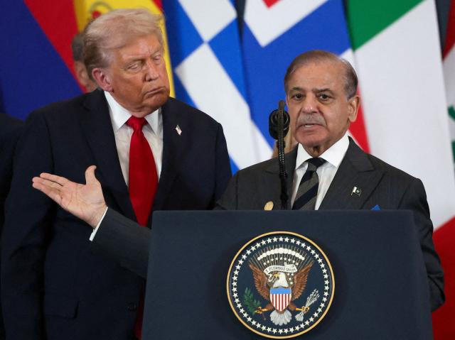 Pakistani Prime Minister Shehbaz Sharif (R) speaks as US President Donald Trump listens during the Gaza summit in Sharm El-Sheikh on October 13, 2025. Trump landed in Egypt on October 13 for a summit on Gaza, following a lightning visit to Israel after a ceasefire he brokered entered into force. (Photo by Suzanne Plunkett / POOL / AFP)