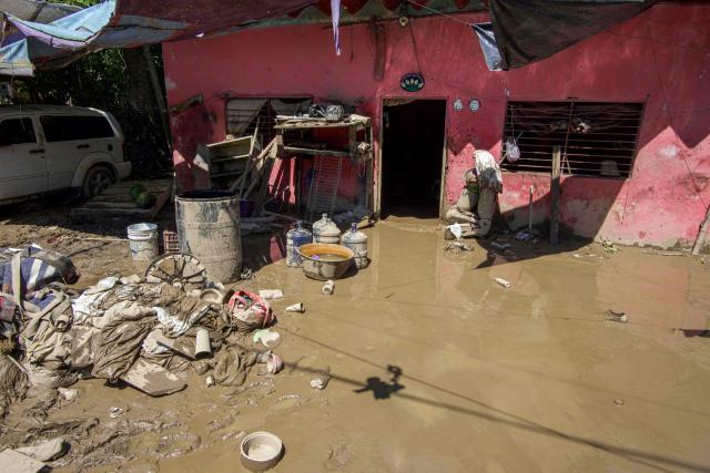 View of a flooded house after severe flooding affected the town of Alamo, in Veracruz state, Mexico, on October 13, 2025. The death toll from flooding in central and eastern Mexico -mostly in the Veracruz, Hidalgo and Puebla states- has risen sharply to at least 64, with another 65 still missing, authorities reported. (Photo by Marco Antonio Perez / AFP)