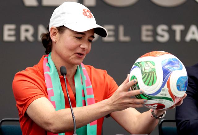 Former Mexican golfer Lorena Ochoa holds an official FIFA 2026 World Cup ball as the tournament's ambassador during a press conference in Guadalajara, Jalisco state, Mexico, on October 13, 2025. (Photo by ULISES RUIZ / AFP)