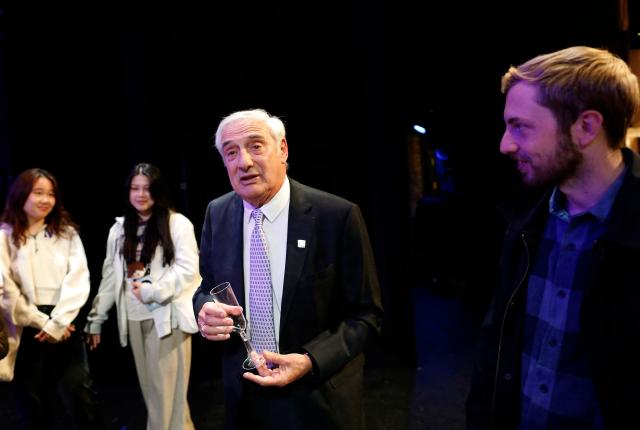 US-Israeli professor Joel Mokyr (C), talks with faculty, staff, and students, after delivering remarks celebrating his Nobel prize in economics, at Northwestern University in Evanston, Illinois on October 13, 2025. The Nobel prize in economics was awarded on Monday to American-Israeli Joel Mokyr, France's Philippe Aghion and Canada's Peter Howitt for work on technology's impact on sustained economic growth. (Photo by OCTAVIO JONES / AFP)