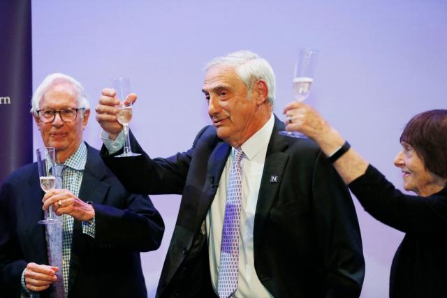 Northwestern Interim President Henry S. Bienen (L), US-Israeli professor Joel Mokyr (C), and his wife, Margalit Mokyr, toast celebrating Mokyr's Nobel prize in economics, at Northwestern University in Evanston, Illinois on October 13, 2025. The Nobel prize in economics was awarded on Monday to American-Israeli Joel Mokyr, France's Philippe Aghion and Canada's Peter Howitt for work on technology's impact on sustained economic growth. (Photo by OCTAVIO JONES / AFP)