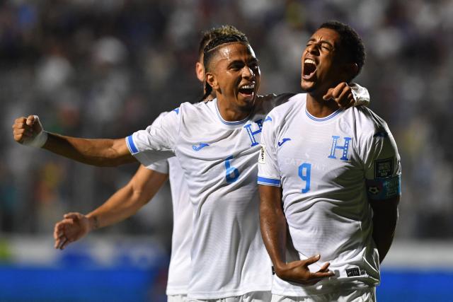 Honduras' forward #09 Anthony Lozano (R) celebrates with teammate defender #06 Cristopher Melendez after scoring his team's second goal during the 2026 FIFA World Cup Concacaf qualifier football match between Honduras and Haiti at the Chelato Ucles National Stadium in Tegucigalpa on October 13, 2025. (Photo by Orlando SIERRA / AFP)
