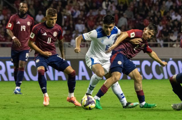 Nicaragua's forward #16 Junior Arteaga fights for the ball with Costa Rica's forward #11 Kenneth Vargas and midfielder #02 Aaron Murillo during the 2026 FIFA World Cup Concacaf qualifier football match between Costa Rica and Nicaragua at the National Stadium in San Jose on October 13, 2025. (Photo by EZEQUIEL BECERRA / AFP)