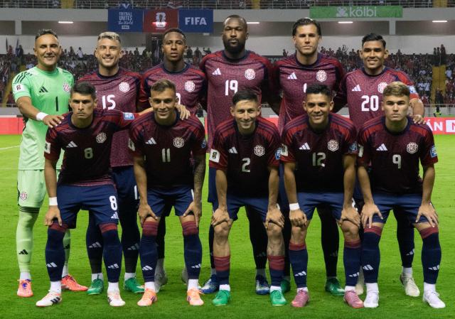 Costa Rica players pose for a team photo ahead of the 2026 FIFA World Cup Concacaf qualifier football match between Costa Rica and Nicaragua at the National Stadium in San Jose on October 13, 2025. (Photo by EZEQUIEL BECERRA / AFP)