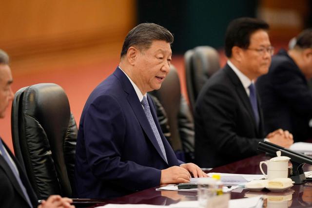 Chinese President Xi Jinping speaks during a meeting with Ghana President John Mahama (not pictured) at the Great Hall of the People in Beijing on October 14, 2025. (Photo by Ichiro Banno / POOL / AFP)