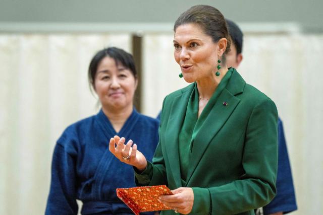 Crown Princess Victoria of Sweden (R) attends a martial arts demonstration as she visits the Joint Staff College, an educational institution administered by the Ministry of Defence's Joint Staff Office, in Tokyo on October 14, 2025. (Photo by Kazuhiro NOGI / AFP)