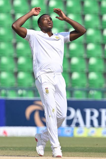 South Africa's Kagiso Rabada reacts after bowling during the third day of the first Test cricket match between Pakistan and South Africa at the Gaddafi Stadium in Lahore on October 14, 2025. (Photo by Aamir QURESHI / AFP)