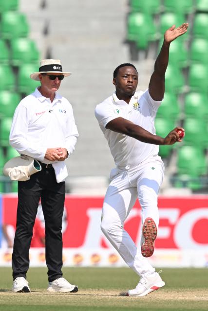 South Africa's Kagiso Rabada bowls during the third day of the first Test cricket match between Pakistan and South Africa at the Gaddafi Stadium in Lahore on October 14, 2025. (Photo by Aamir QURESHI / AFP)